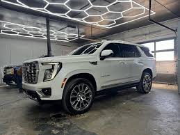 White GMC Yukon Denali in the shop
